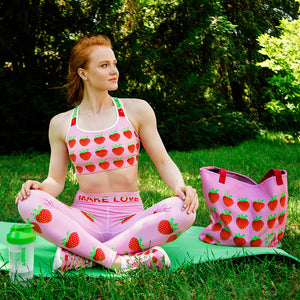 pink strawberry yoga leggings beach bag sports bra on woman