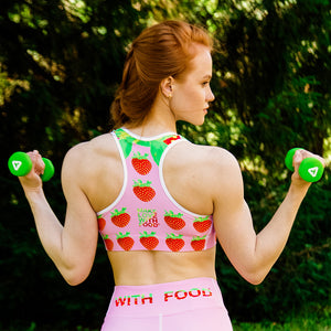 pink strawberry yoga sports bra on woman back